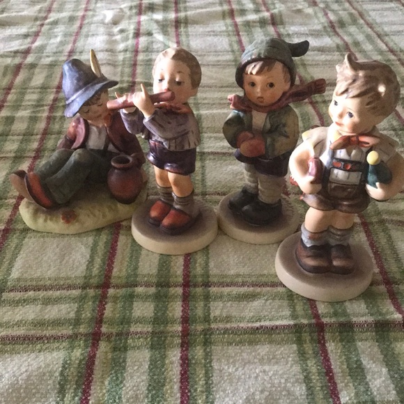 Four adorable boy Hummel statues for sale